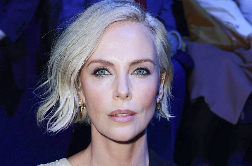  She’s even prettier this way: Charlize Theron, 47, was caught out walking in a crumpled skirt and unbuttoned blouse