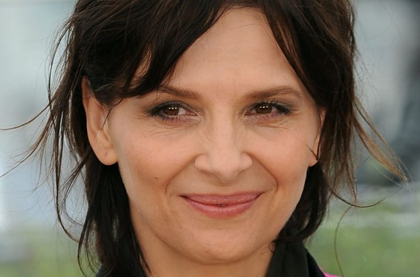  Purple cape with fringe: Juliette Binoche took to the stage in an unusual outfit